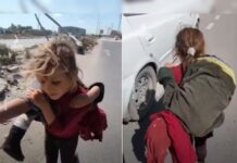 Menina carrega irmã ferida na Faixa de Gaza em busca de ajuda